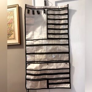 Jewelry holder with detached travel pouch.